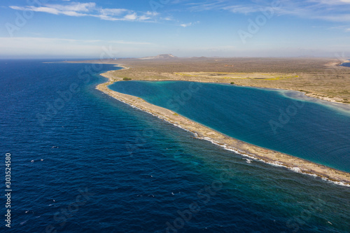 Aerial view of coast of Curaçao in the Caribbean Sea with turquoise water, cliff, beach and beautiful coral reef around Eastpoint photo