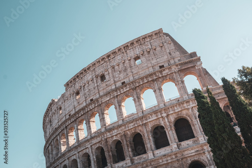 view of Rome Colosseum in Rome , Italy . The Colosseum was built in the time of Ancient Rome in the city center