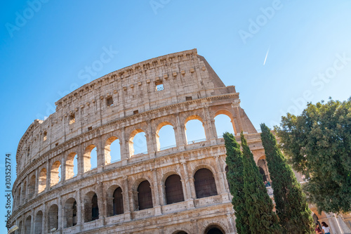 view of Rome Colosseum in Rome , Italy . The Colosseum was built in the time of Ancient Rome in the city center
