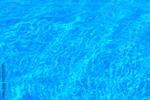 The texture of the water in the pool azure  background