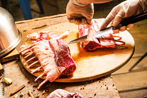 chef preparing mutton ribs for bbq photo