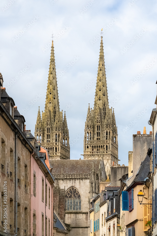 Quimper in Brittany, the Saint-Corentin cathedral in a beautiful medieval street 