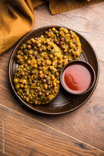 Chana Dal Bhabra / Babra served with tomato ketchup, popular food from Bihar / Bhojpur of India photo