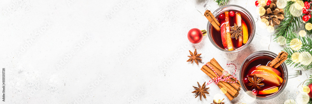 Mulled wine with christmas decorations on white. - obrazy, fototapety, plakaty 