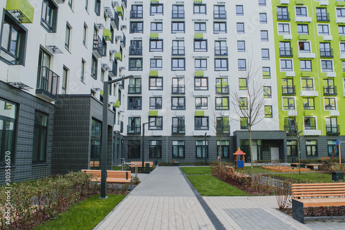 new residential quarter of new buildings: a modern playground in the courtyard o Fotobehang