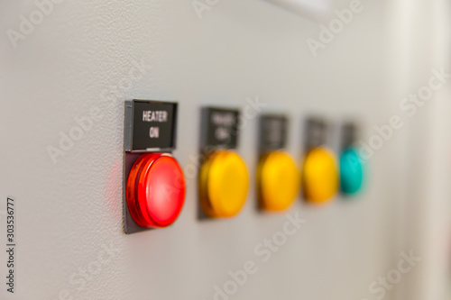Power distributing cabinet,Electrical selector switch,button switch,Electrical switch gear at Low Voltage motor control center cabinet in power plant. blurred for background.