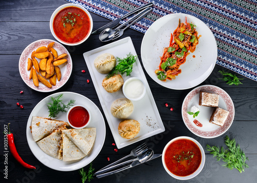 Assorted Uzbek food set, pilaf, samsa, lagman, manta and Korean carrots, set of uzbek food photo