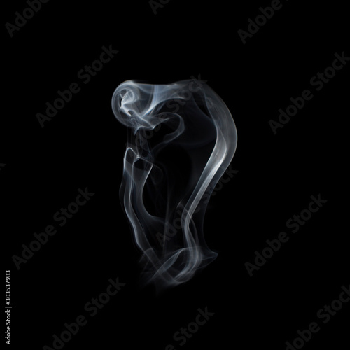 Beautiful swirls of white smoke on a black background