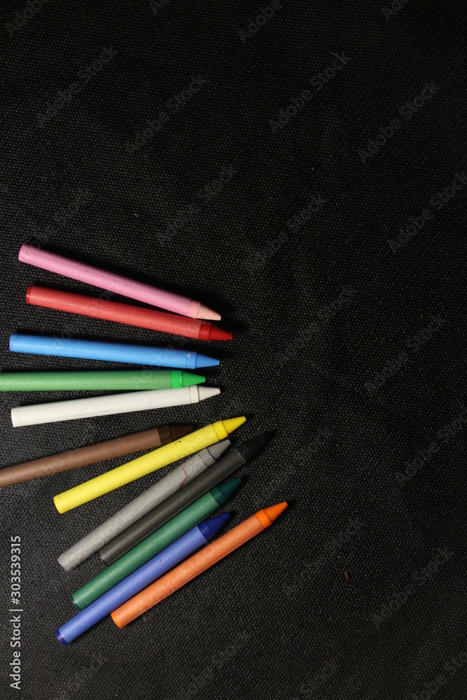 pencils on black background pencils on black background