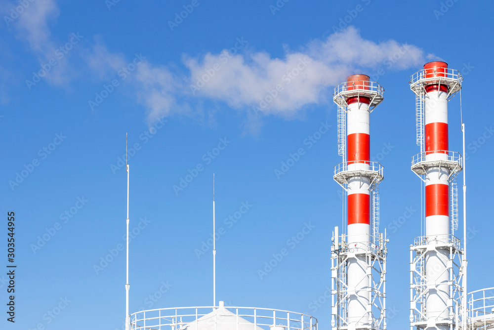 Factory plant stack over blue sky background. Thermal condensing power plant. Energy generation and air pollution industrial scene Stock Photo | Adobe Stock