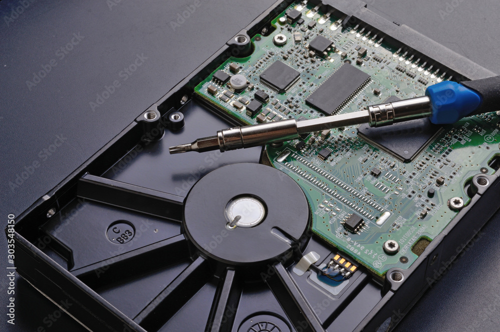 disassembly of the hard drive with a screwdriver and repair disassembly of the hard drive with a screwdriver and repair