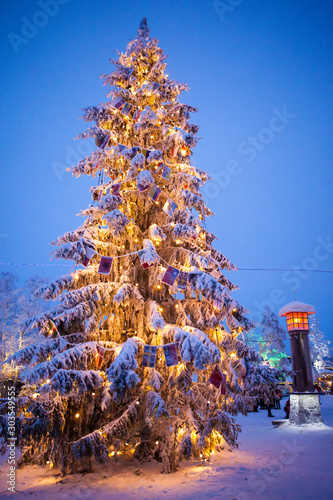 Christmas tree on the street. Santa claus village. lapland finland. photo