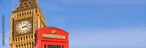 Red telephone box and Big Ben,  panoramic background of London, UK