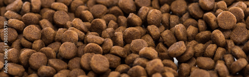 brown dry pet food background with copy space, panoramic shot