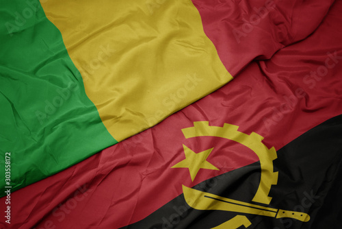 waving colorful flag of angola and national flag of mali.