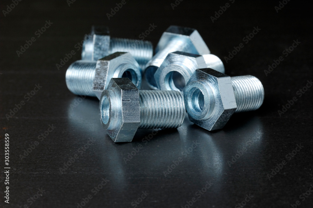 Close-up of several chrome metal bolts Close-up of several chrome metal bolts