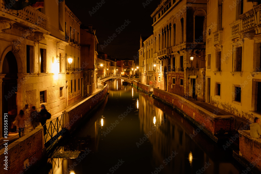 Bridge over canal in venice at night