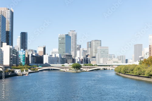 Abstract blurred photo of Osaka cityscape, central business district of Osaka © RobbinLee