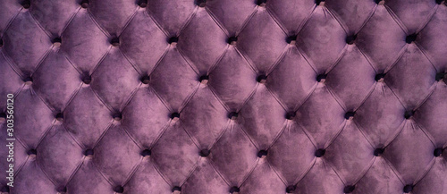 Chesterfield style quilted upholstery backdrop close up. Capitone pattern texture background