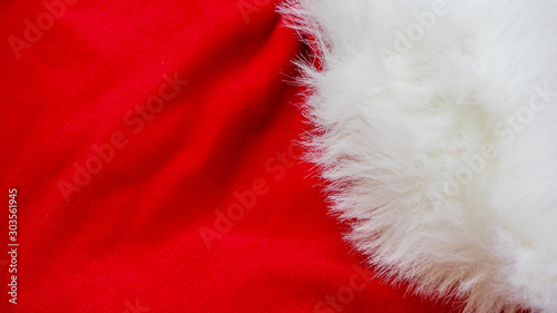 red and white fabric christmas background, red cloth and soft white fur