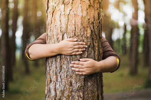 Woman hug the  tree