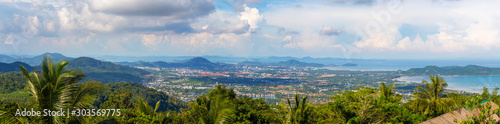 Panorama of Phuket from a height, green hills in the middle of the sea