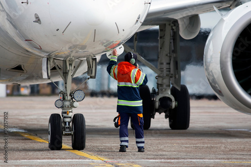 A ground control manager prepares for departing of aircraft from the airport