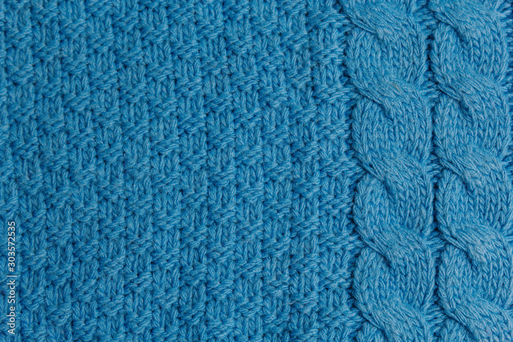 Pattern of colorful knitted sweaters closeup. Handmade merino wool product. Knitting patterns. Pattern of colorful knitted sweaters closeup. Handmade merino wool product. Knitting patterns.