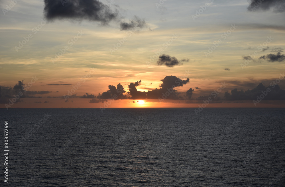 Beautiful sunset over the Atlantic Ocean, view from the sailing ship. 