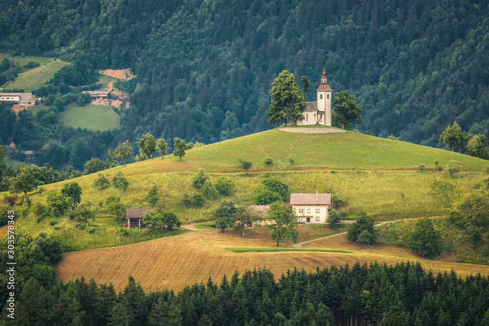 Church on the hill on a beautiful day in Sveti Tomaz, Skofja Loka, Slovenia