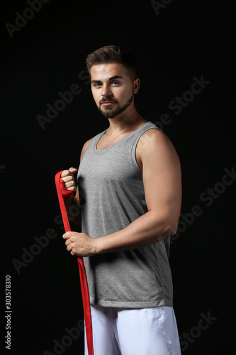 Sporty young man applying w...