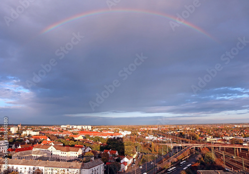 Rainbow over the city in autumn time