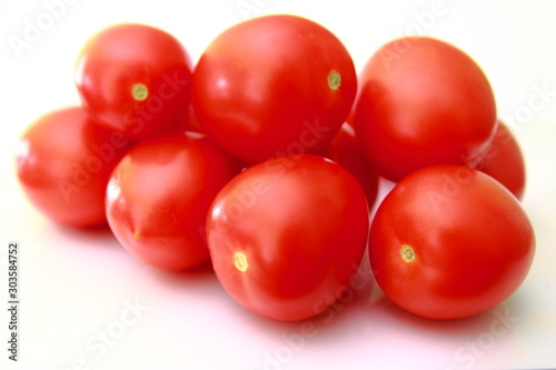 Vegetarian shop with ripe vegetables. Gently folded red tomatoes. Fresh harvest from the farm.