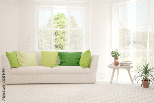 Stylish room in white color with sofa and summer landscape in window. Scandinavian interior design. 3D illustration