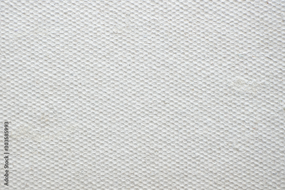 Impression with shallow recesses on cardboard. Paper surface close-up. Impression with shallow recesses on cardboard. Paper surface close-up.