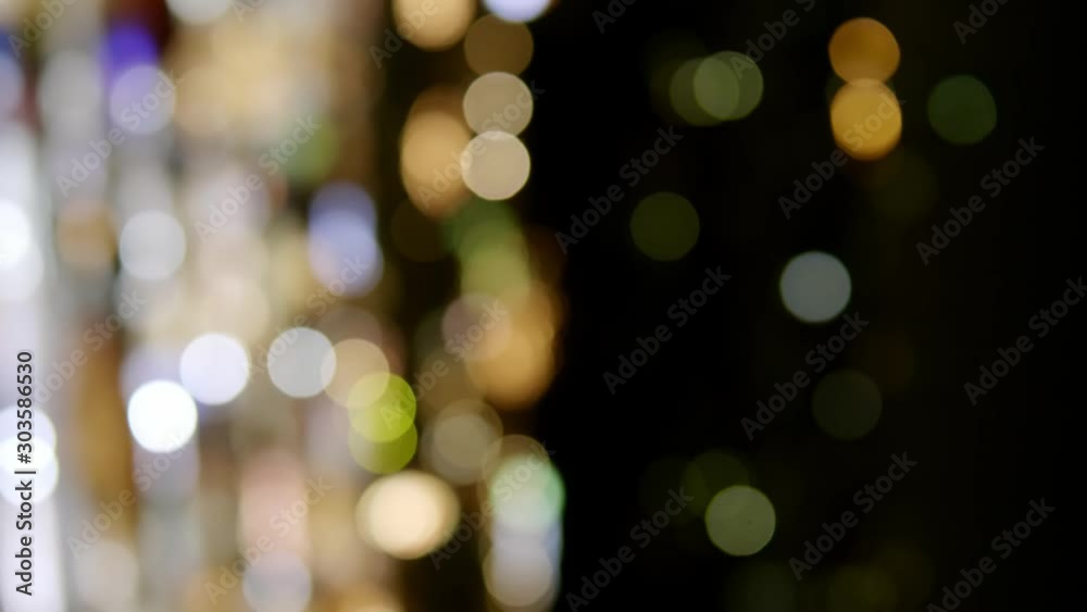 The bokeh light abstract of the garden in the city background at night time and motion rotation. 4K 25fps The bokeh light abstract of the garden in the city background at night time and motion rotation. 4K 25fps