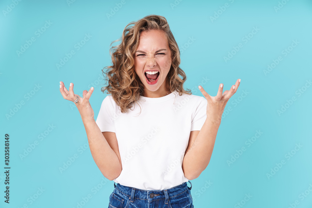 Tableau sur toile Attractive lovely young girl wearing casual clothing standing