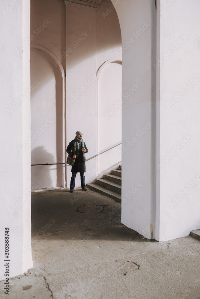 Fototapeta premium Male worker is waiting for somebody in underground