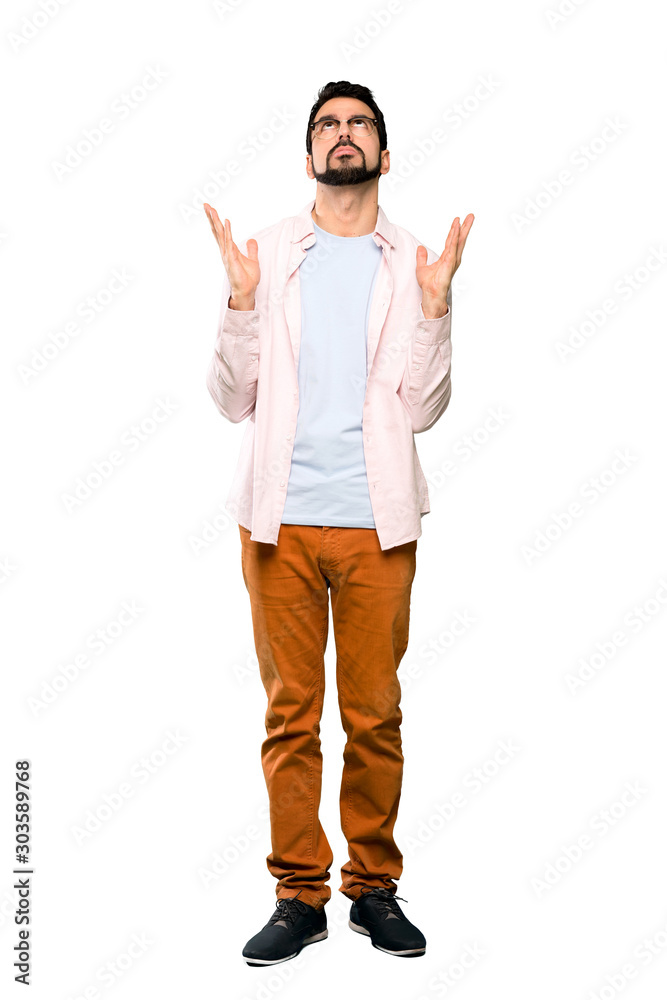 Full-length shot of Handsome man with beard frustrated by a bad situation over isolated white background