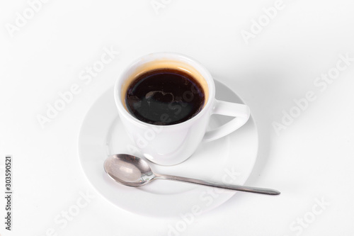 a cup of coffee on a saucer on a white background