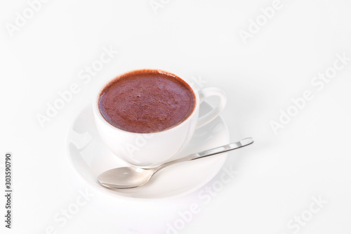 cup of hot chocolate against white background