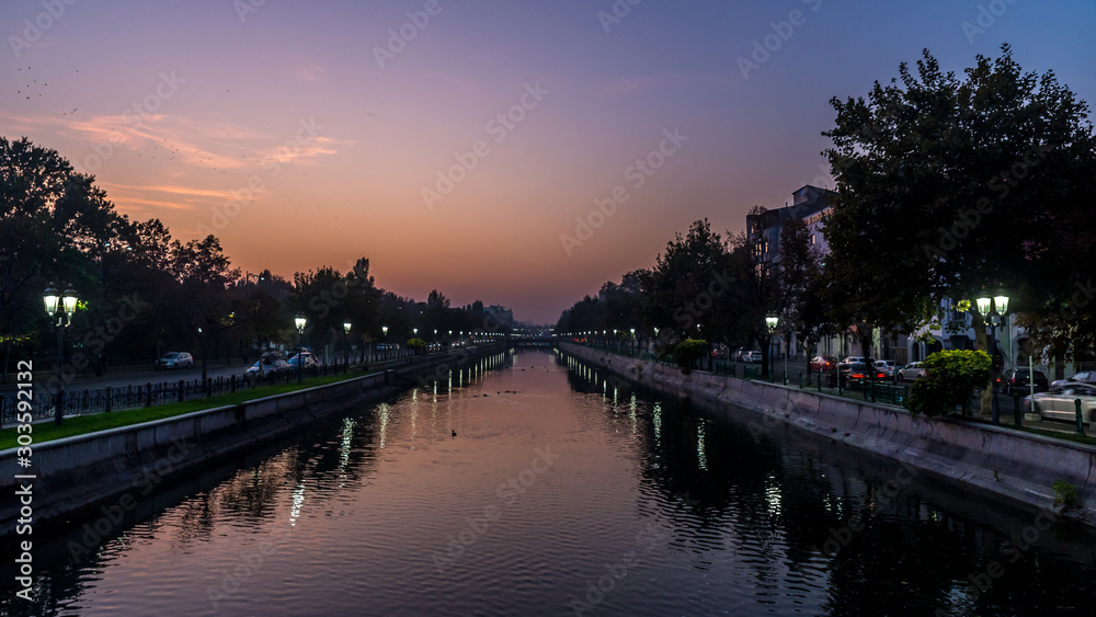 Beautiful sunset Bucharest Romania Bucuresti Dambovita river landscape reflection