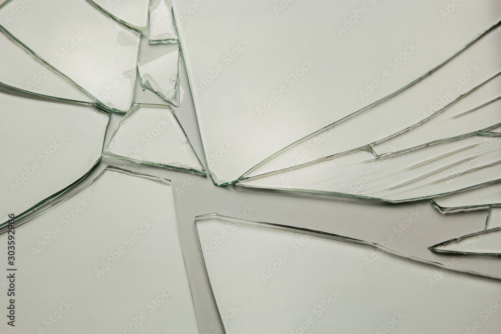 Broken glass background for your images isolated on white. Many large fragments of crumbled. Broken glass background for your images isolated on white. Many large fragments of crumbled.