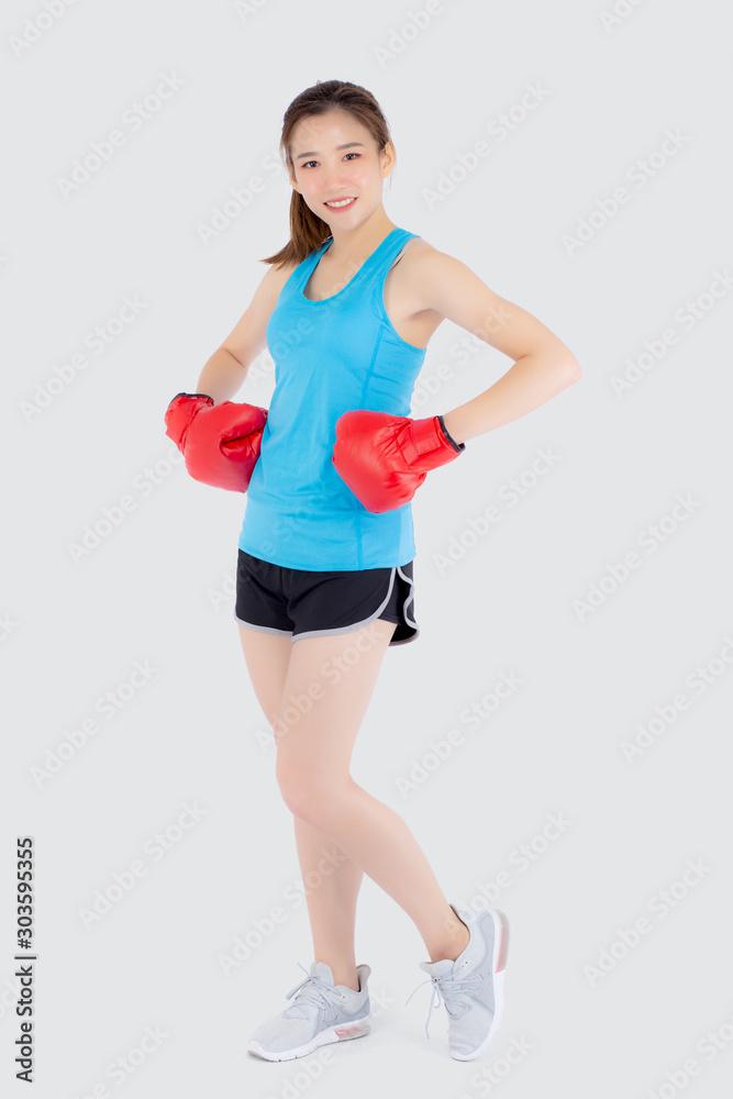 Beautiful portrait young asian woman wearing red boxing gloves with strength and strength isolated on white background, girl workout exercise is sport training with punch, health concept. Beautiful portrait young asian woman wearing red boxing gloves with strength and strength isolated on white background, girl workout exercise is sport training with punch, health concept.