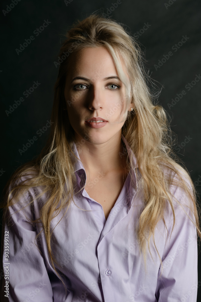 Portrait of beautiful sensual woman with green eyes. Studio shot. Portrait of beautiful sensual woman with green eyes. Studio shot.