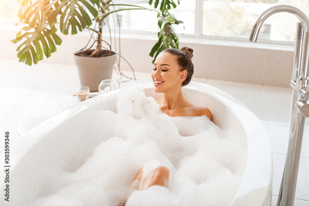Beautiful young woman relaxing in bathtub Beautiful young woman relaxing in bathtub