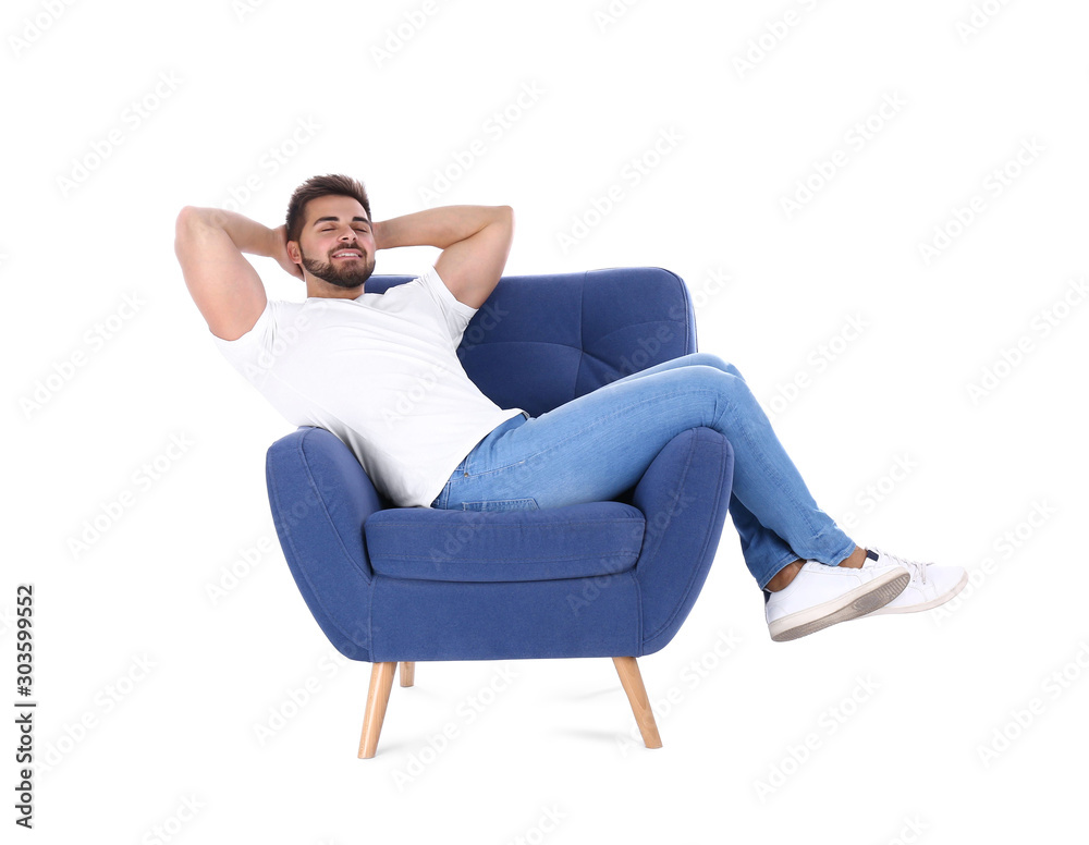 Young man resting in armchair isolated on white Young man resting in armchair isolated on white