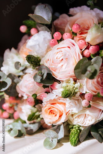 Wedding flowers  bridal bouquet closeup. Decoration made of roses  peonies and decorative plants