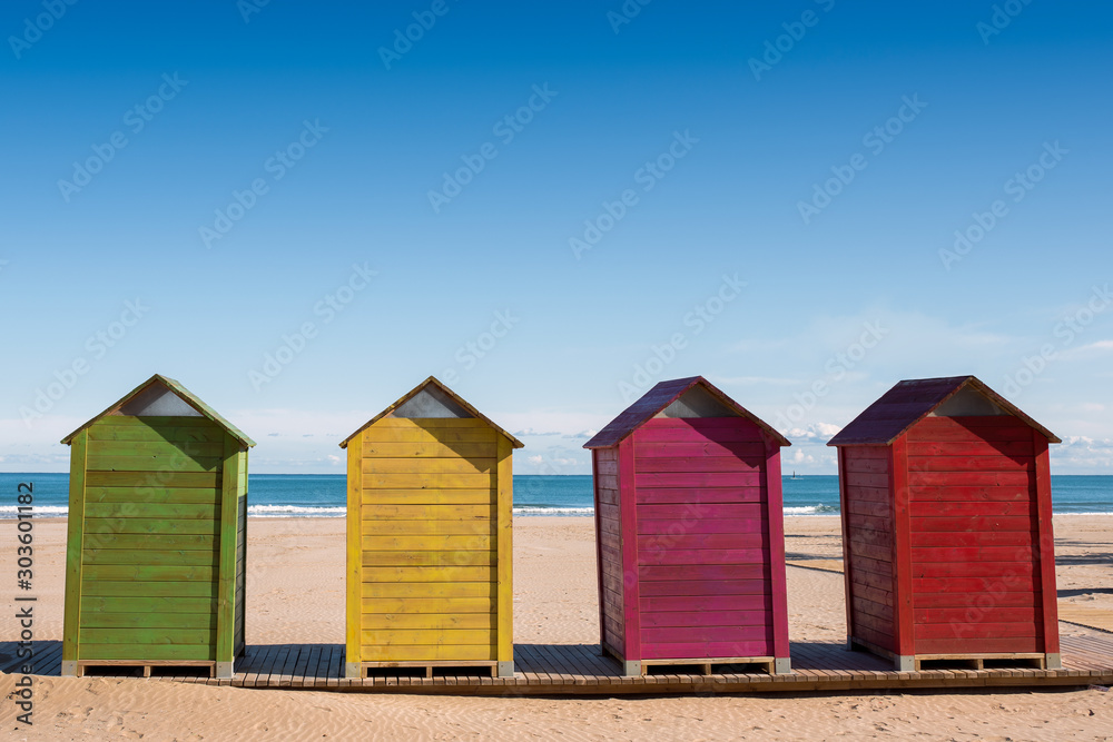 Wooden cabins to change clothes on Cullera beach, Valencia, Spain