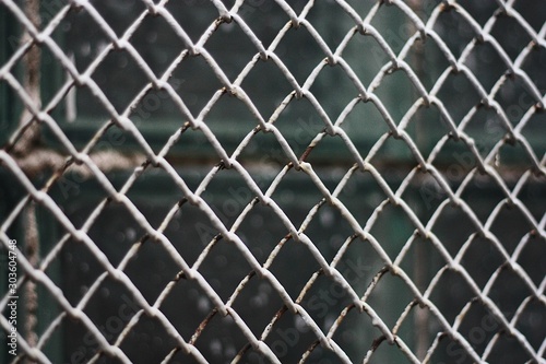 White iron lattice on the window macro view